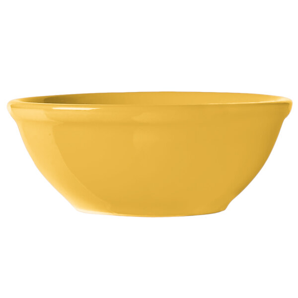 A close-up of a Libbey Veracruz marigold yellow oatmeal bowl.