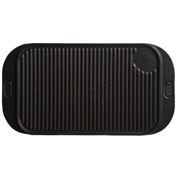 A black rectangular Libbey cast iron grill pan with lines.