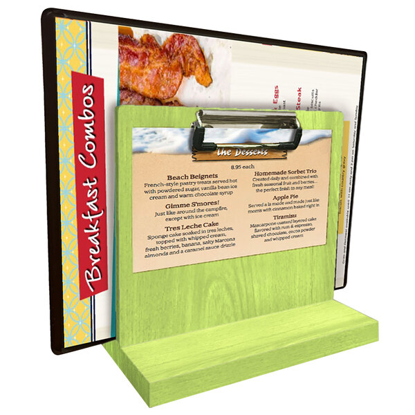 A lime wood Menu Solutions table stand with a menu on it.