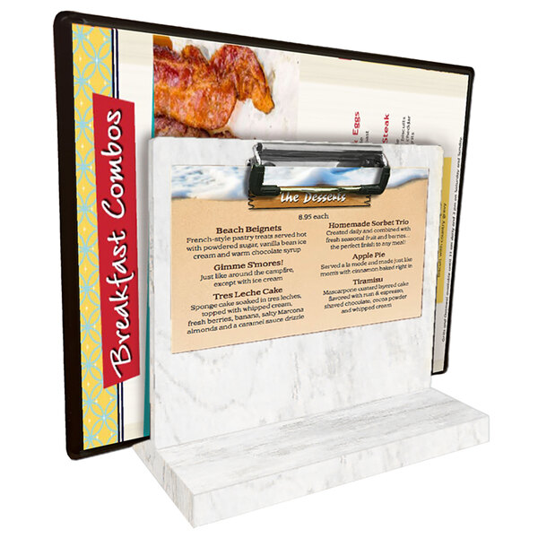 A Menu Solutions white wash wood tabletop menu caddy with a menu clipped to it.