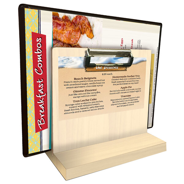 A Menu Solutions natural wood tabletop menu caddy with a clip holding a menu.