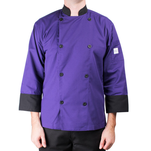 A man wearing a Mercer Culinary purple chef coat.