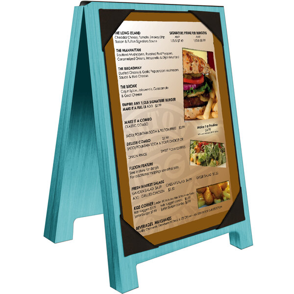 A sky blue wooden Menu Solutions table tent with a menu on it and picture corners holding a picture of a burger.