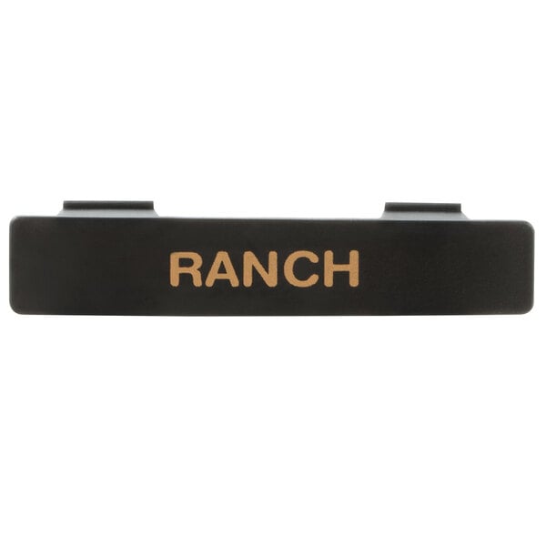A black rectangular Tablecraft dispenser tag with orange "Ranch" text.