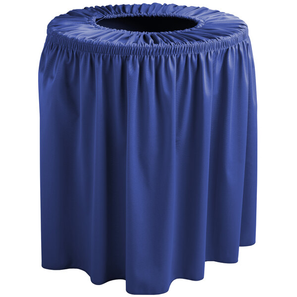 A royal blue table cloth with a ruffled skirt covers a royal blue trash can.