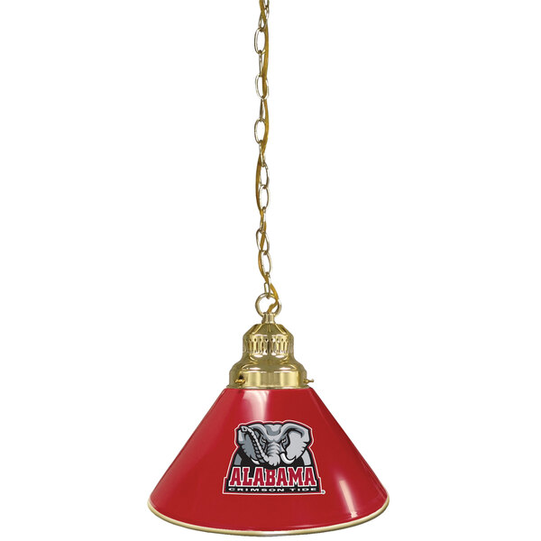 A red lamp shade with a University of Alabama logo on it hanging from a brass chain.