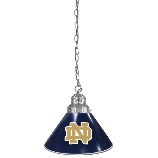 A blue pendant light with a University of Notre Dame logo in gold on the shade.