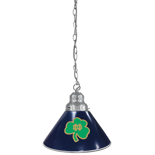 A blue lamp with a green clover on it with chrome accents and a Notre Dame logo.