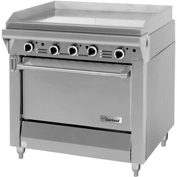 A stainless steel Garland Master Series gas range with a large griddle.