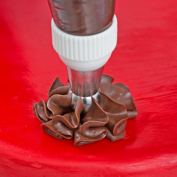A chocolate covered pastry made with an Ateco Russian ball tip piping bag.