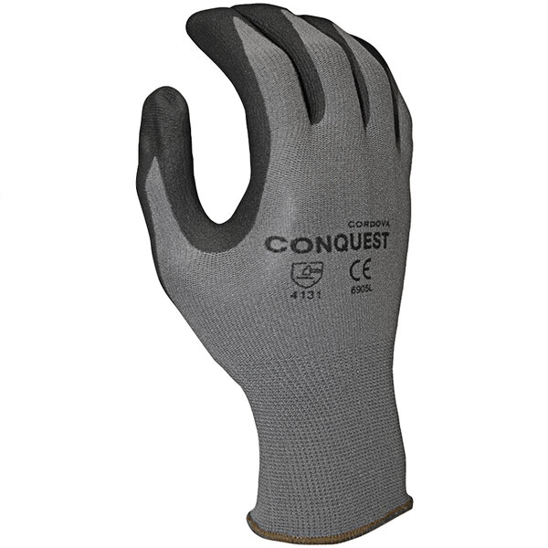 A close-up of a Cordova gray glove with black and gray palm coating.