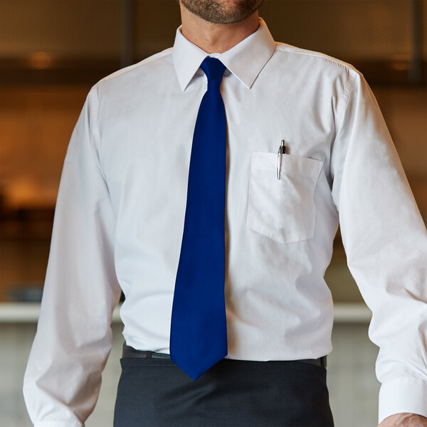 A man wearing a white shirt and a Henry Segal royal blue tie.