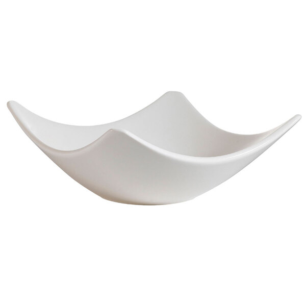 A CAC bone white porcelain square bowl with a curved edge.