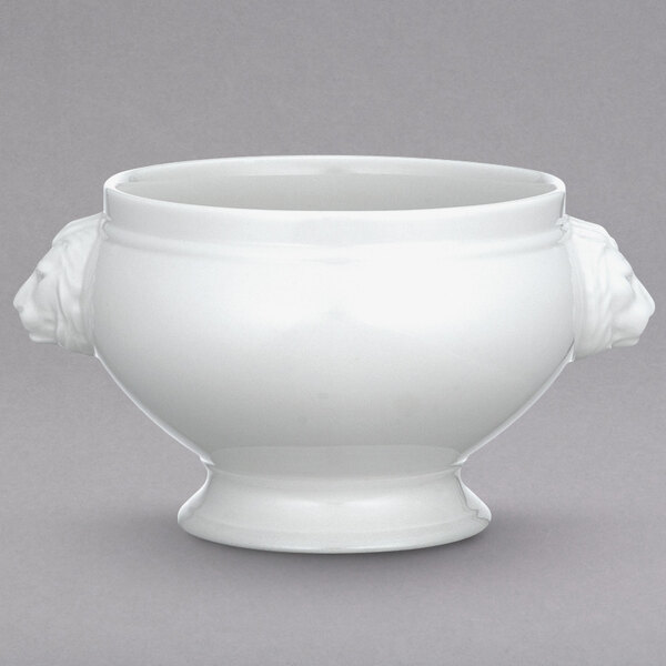 A white Villeroy & Boch porcelain bowl with lion head handles.