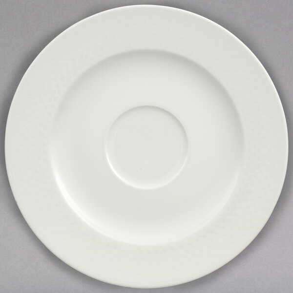 A white Villeroy & Boch porcelain saucer with a circle in the center.