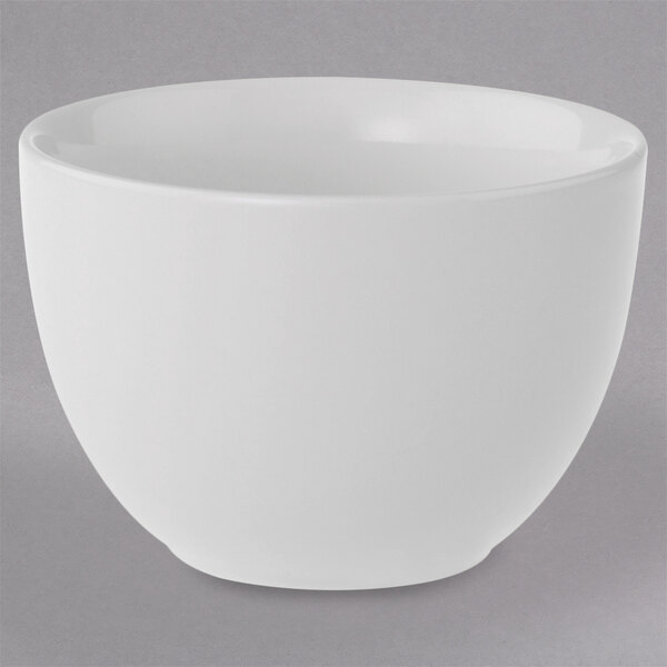 A white Villeroy & Boch porcelain cup on a gray surface.