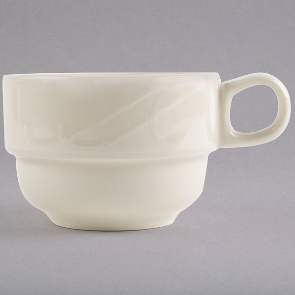 A white Homer Laughlin china tea cup with a handle.
