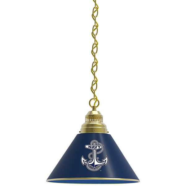 A brass pendant light with a blue and gold United States Navy logo lamp shade.