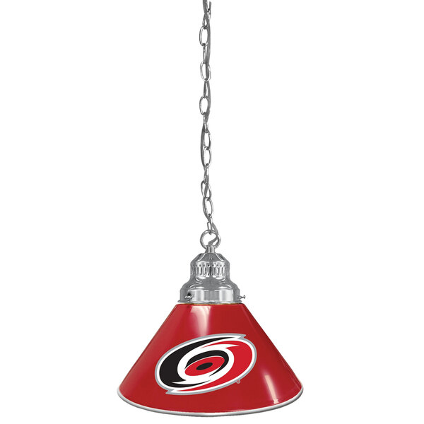 A red lamp with the Carolina Hurricanes logo hanging from a chain.