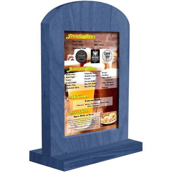 A Menu Solutions True Blue arched wood menu tent on a table with a beer menu.