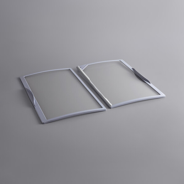 Two rectangular glass lids with white plastic frames.