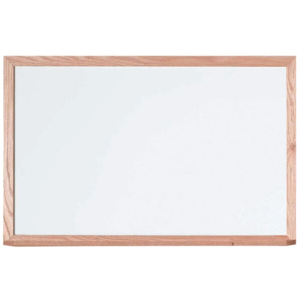 A white Aarco markerboard with a wooden frame.