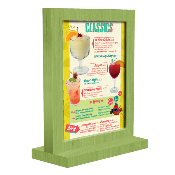 A wood menu tent with a lime green frame holding a menu.