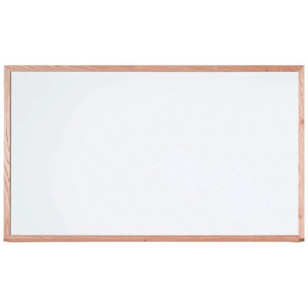 A white board with a wooden frame.