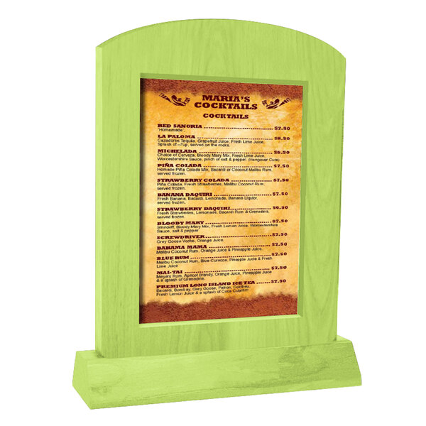 A lime wood arched menu tent on a table with a menu in it.