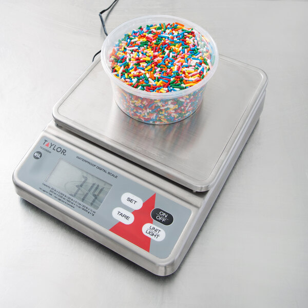 A bowl of sprinkles on a Taylor digital portion scale.