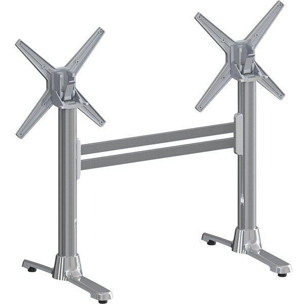 A pair of silver FLAT Tech table bases with two legs.