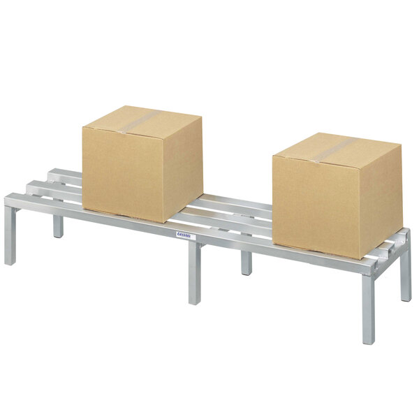 A Channel aluminum dunnage rack with two boxes on it.