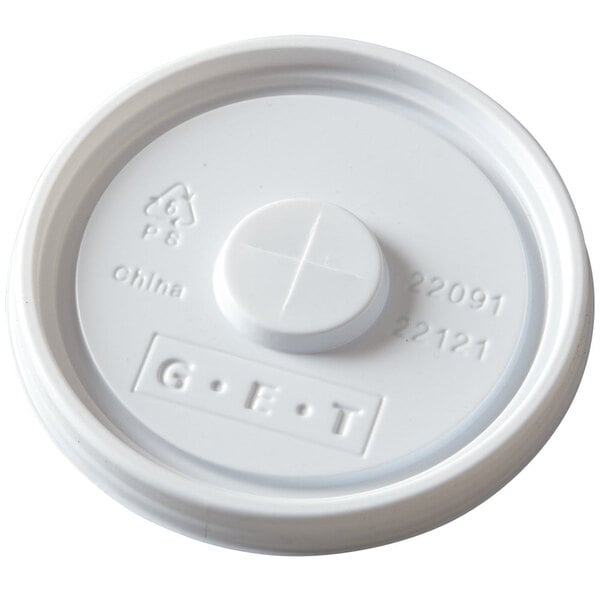 A close up of a white GET lid with a straw slot and cross.
