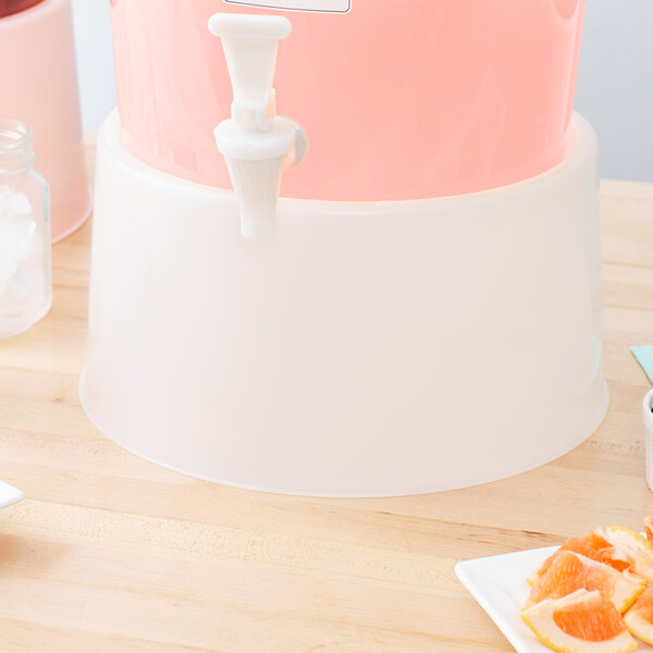 A white and pink Choice beverage dispenser base with a spout.