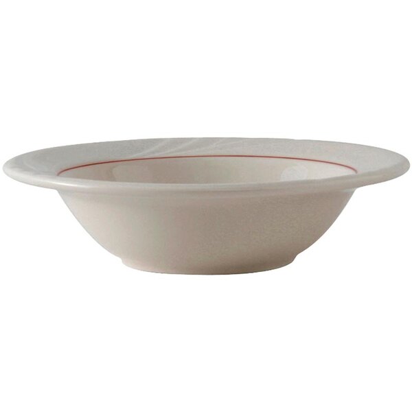 A white Tuxton china bowl with a red band.