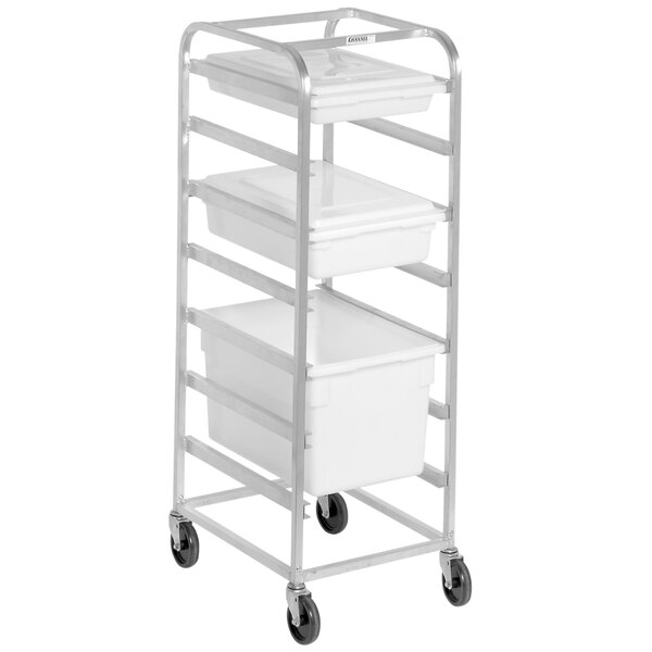 A metal cart with seven aluminum food box racks on it.
