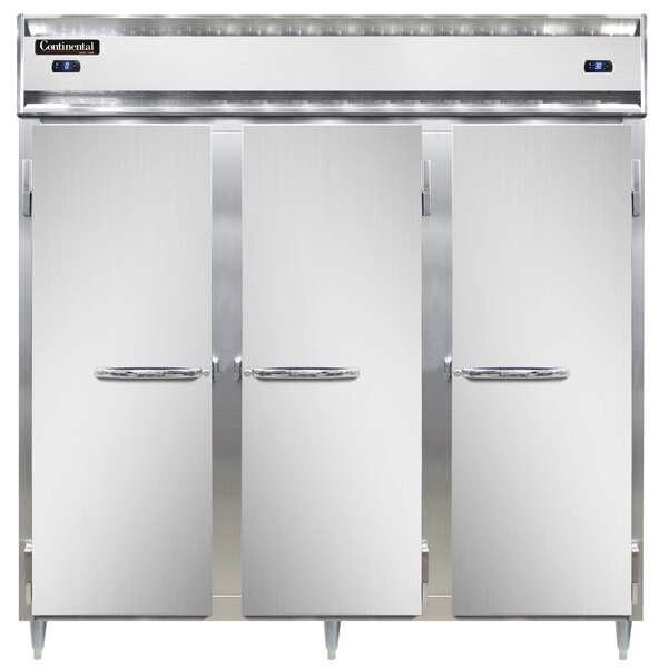 The open doors of three white Continental refrigerators.
