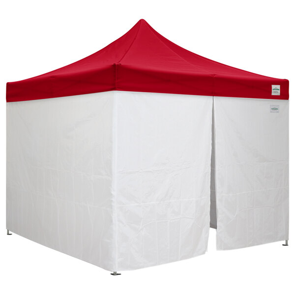 A white and red tent with a red top.