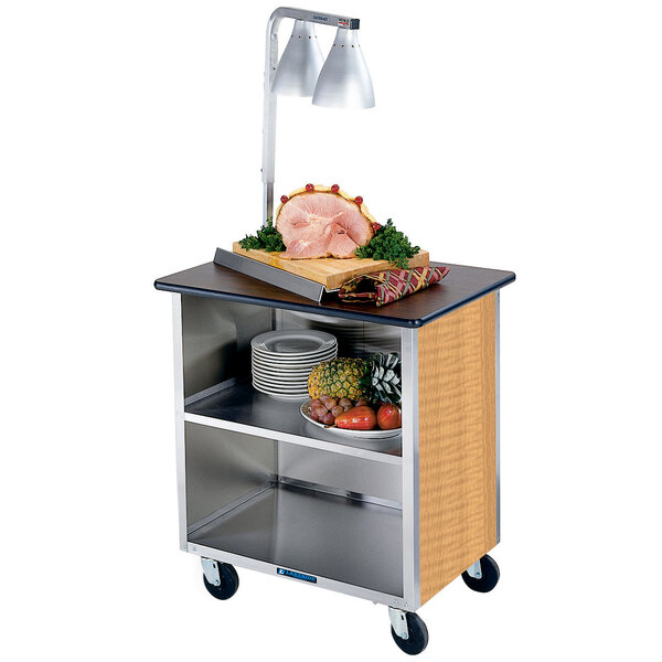 A Lakeside stainless steel utility cart with food on it.