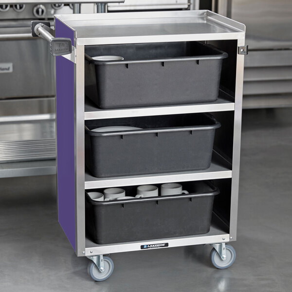 A Lakeside stainless steel utility cart with black containers on the shelves.
