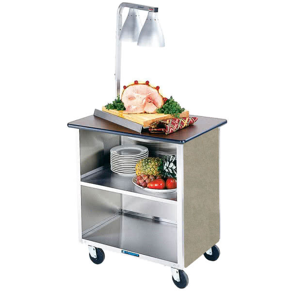 A Lakeside stainless steel utility cart with food on top.