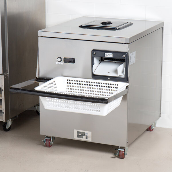 A grey rectangular Campus Products CDM-12K Silvershine Cutlery Dryer / Polisher machine on a counter.