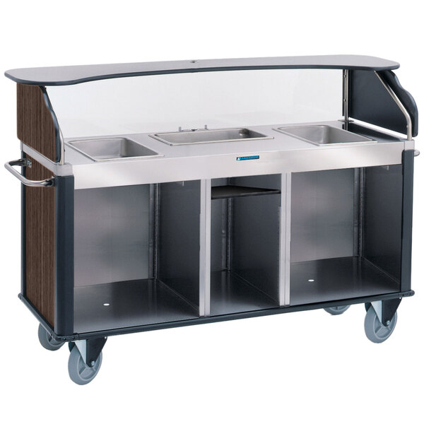 A Lakeside stainless steel vending cart with a walnut laminate counter, three counter wells, and stainless steel counters.