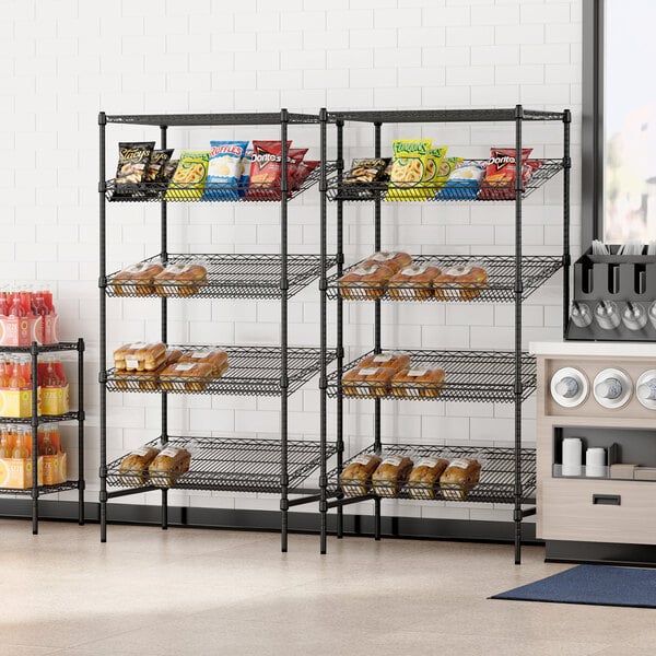 A black metal Regency stationary wire shelving unit with food on the shelves.