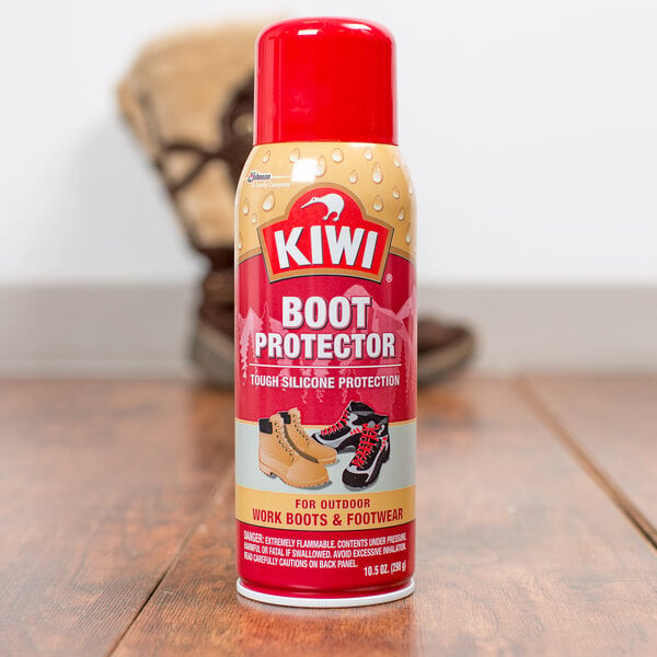 A bottle of SC Johnson Kiwi boot protector on a wooden table.