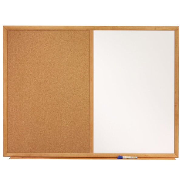 A cork board with a white board and a wooden frame.