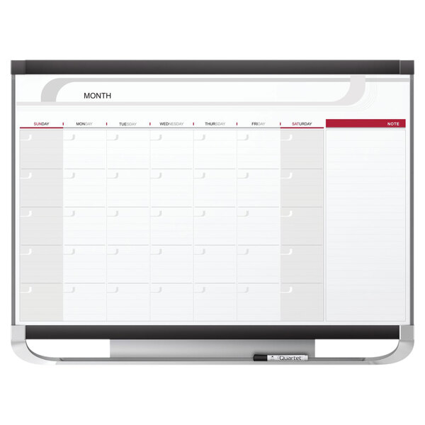 A white Quartet whiteboard with a monthly calendar and black and red lines.