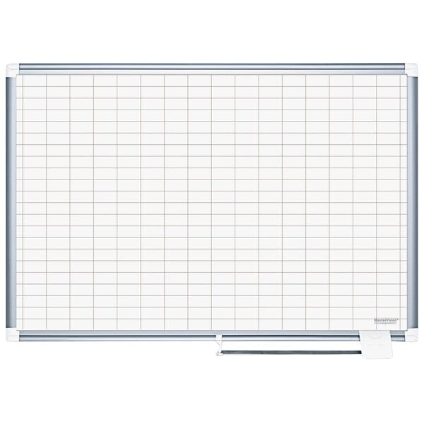 A MasterVision whiteboard with a grid on it.