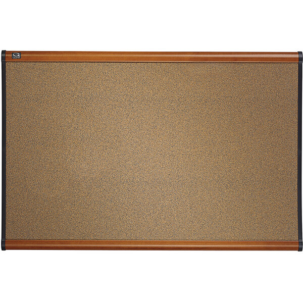 A Quartet cork board with a cherry plastic frame.