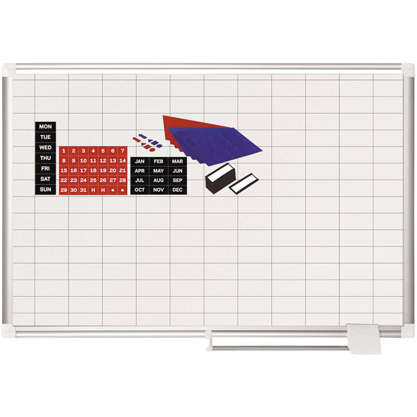 A MasterVision whiteboard with a gridded surface.